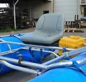NEXUS frame with a seat and gear boxes on a blue raft