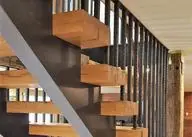 Staircase with wood treads and steel balusters